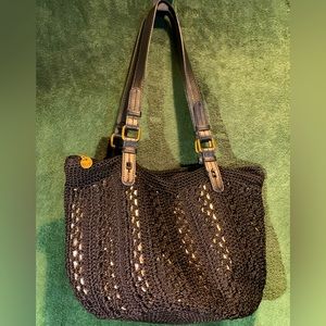 The Sak Black Crotchet bucket shoulder bag with metallic gold underlining